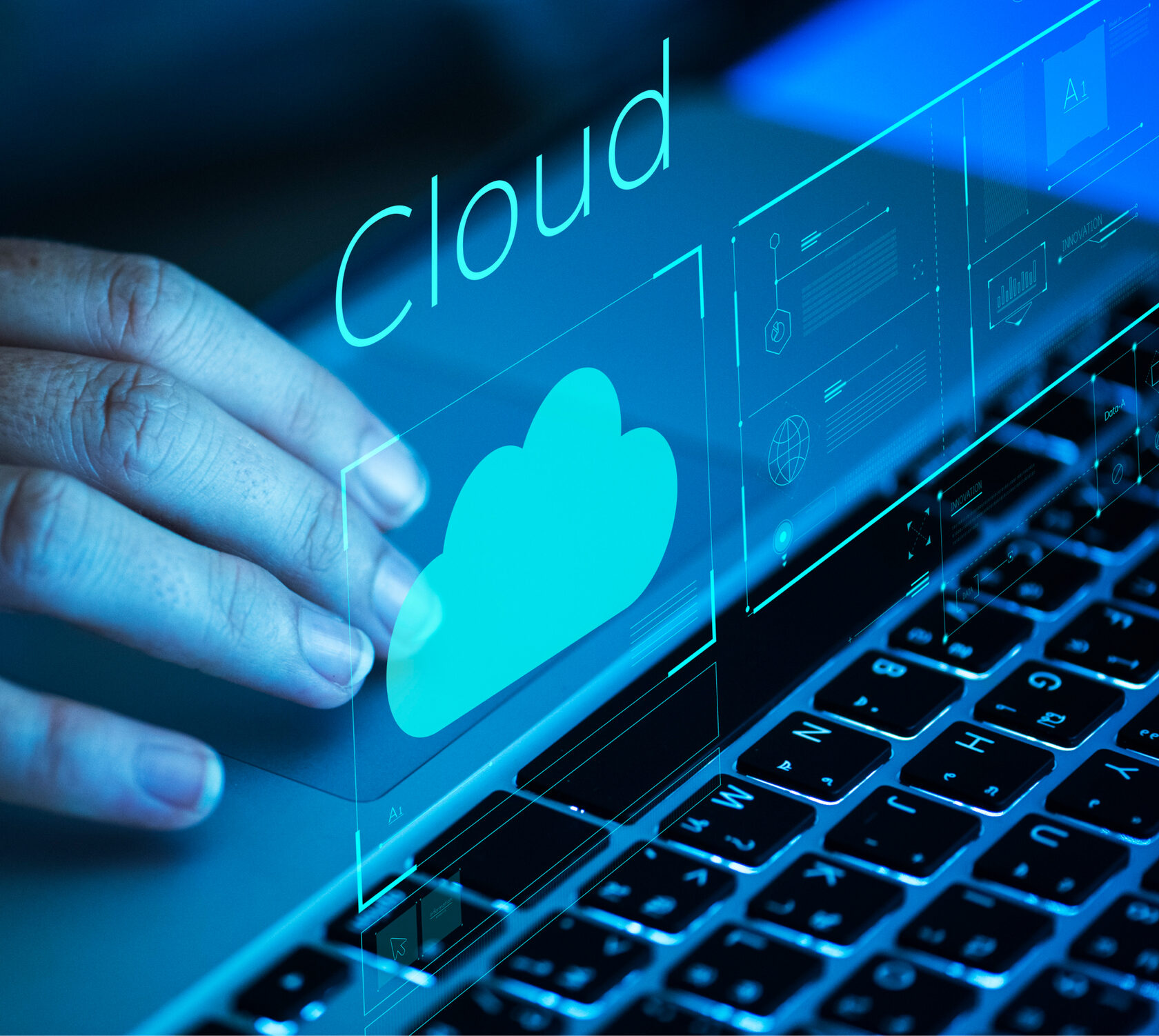 Person using cloud services on a laptop